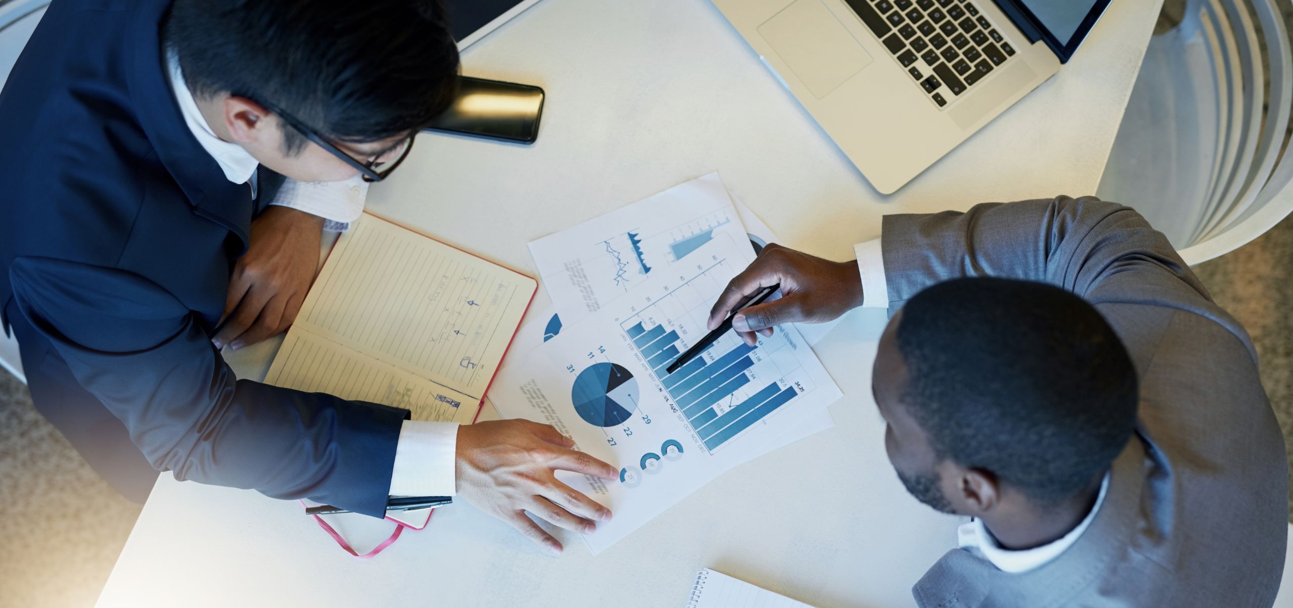 Two people analyzing data to gain insights for market research