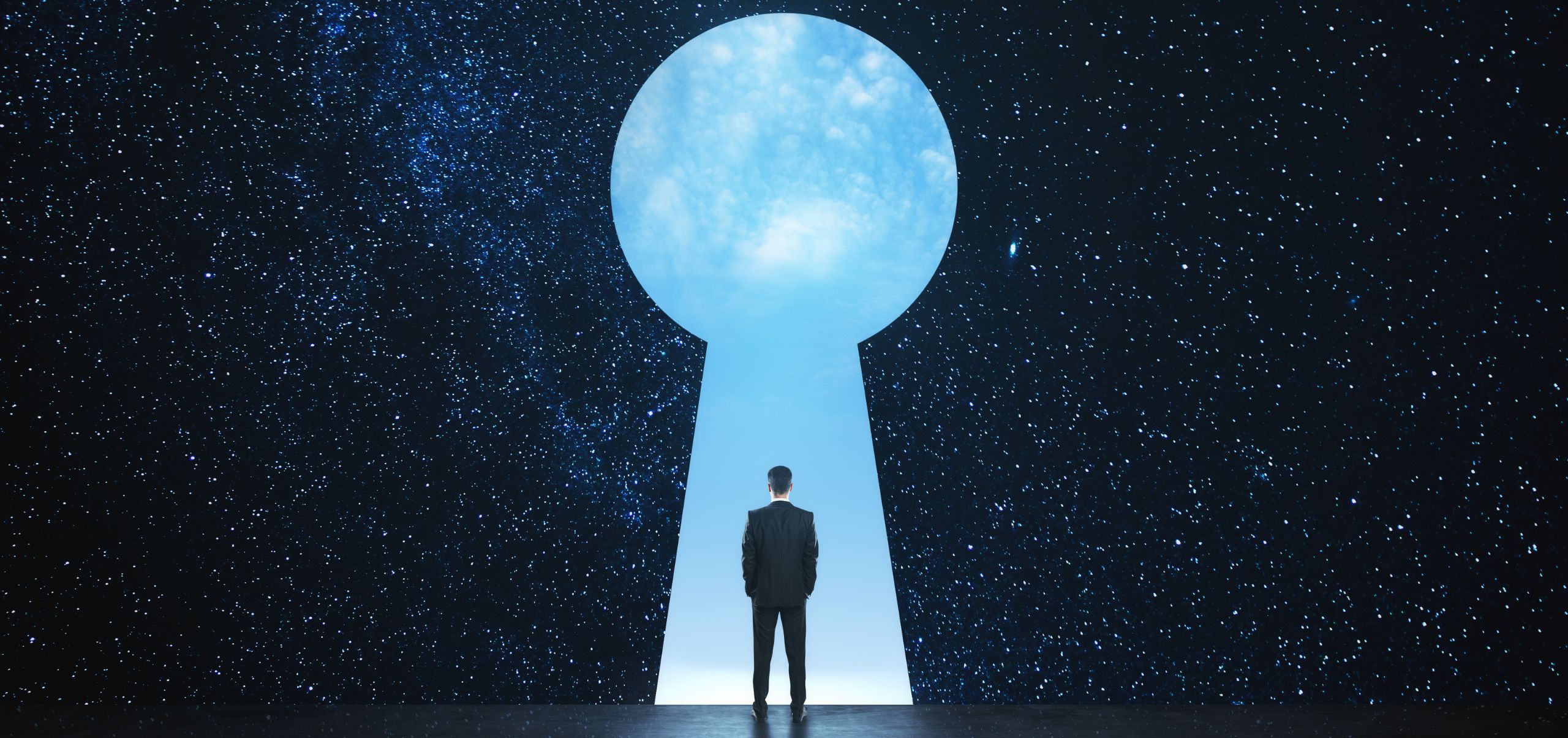 A person standing in front of a large keyhole, symbolizing opportunities unlocked through networking