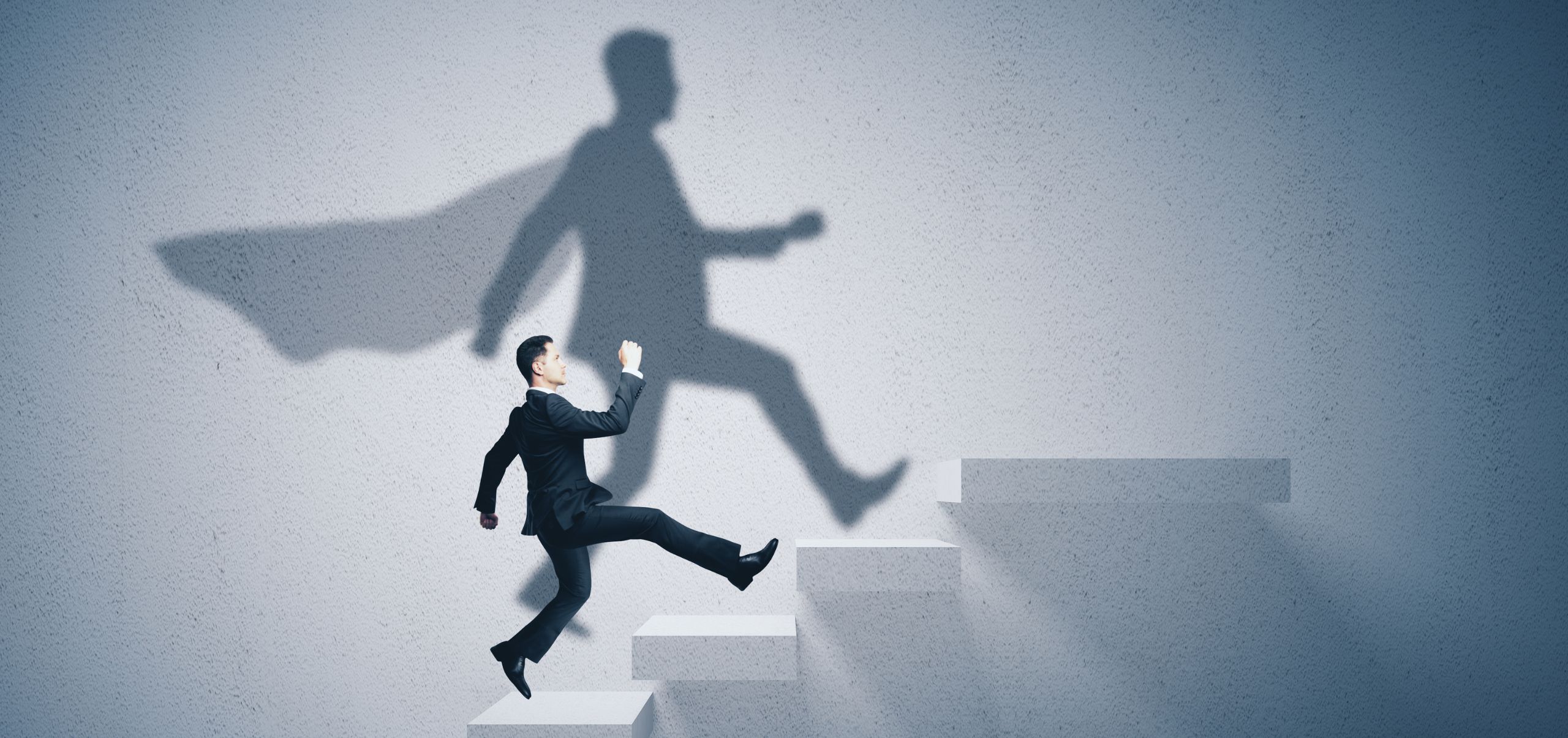 Person climbing a ladder with a shadow wearing a cape, symbolizing personal growth and empowerment