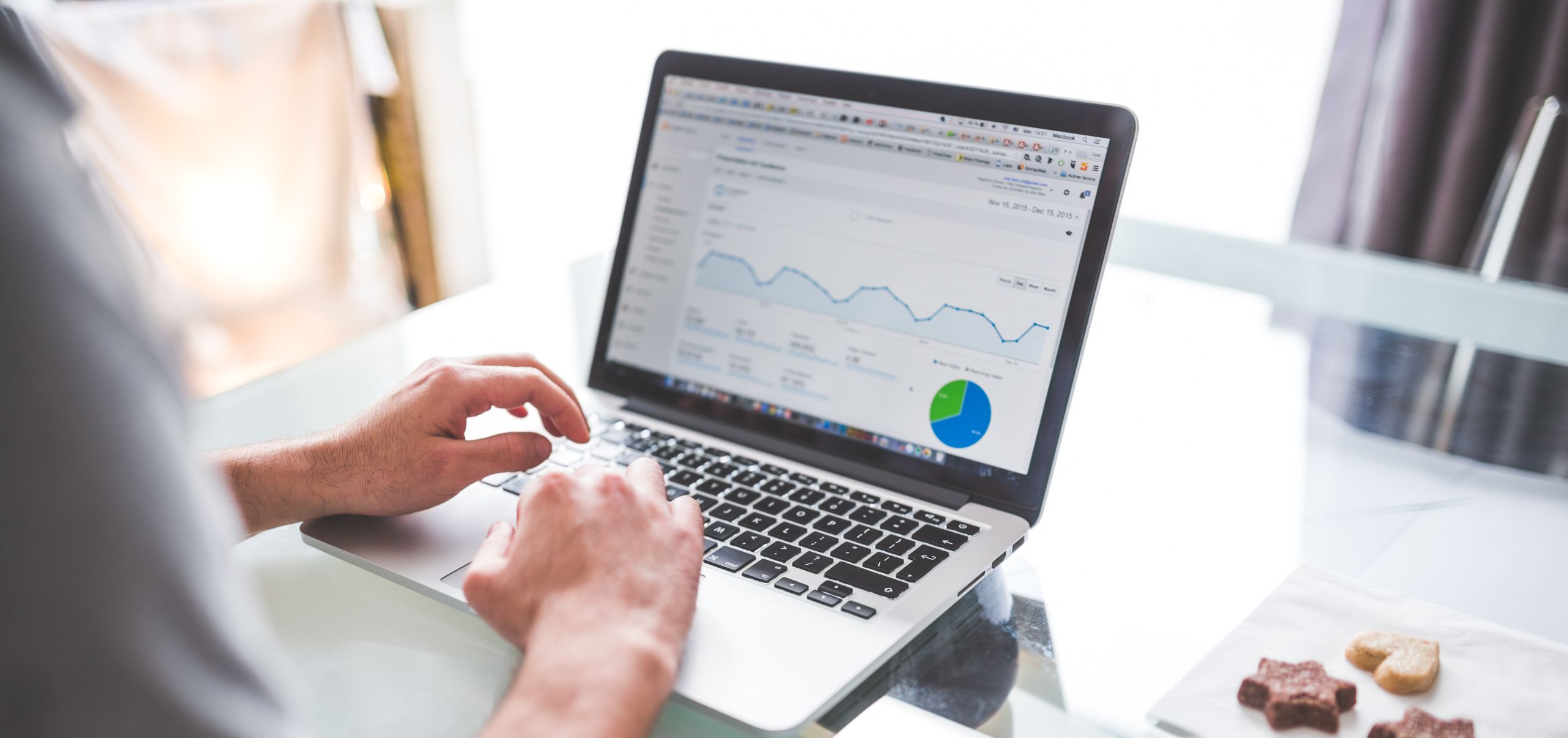 Person viewing statistics on a laptop after launching a business idea