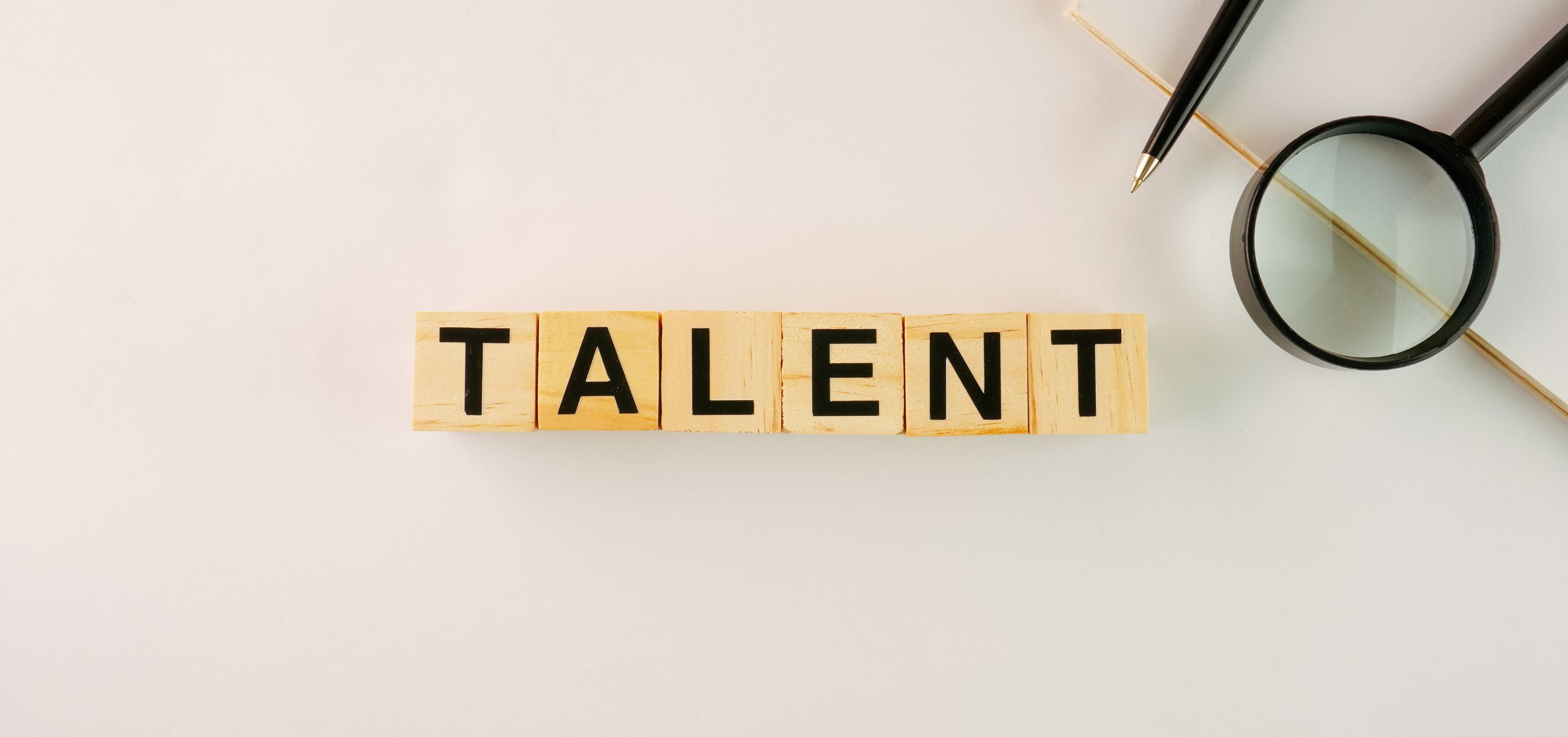 Blocks on a table spelling “Talent,” highlighting the importance of recognizing and managing team skills