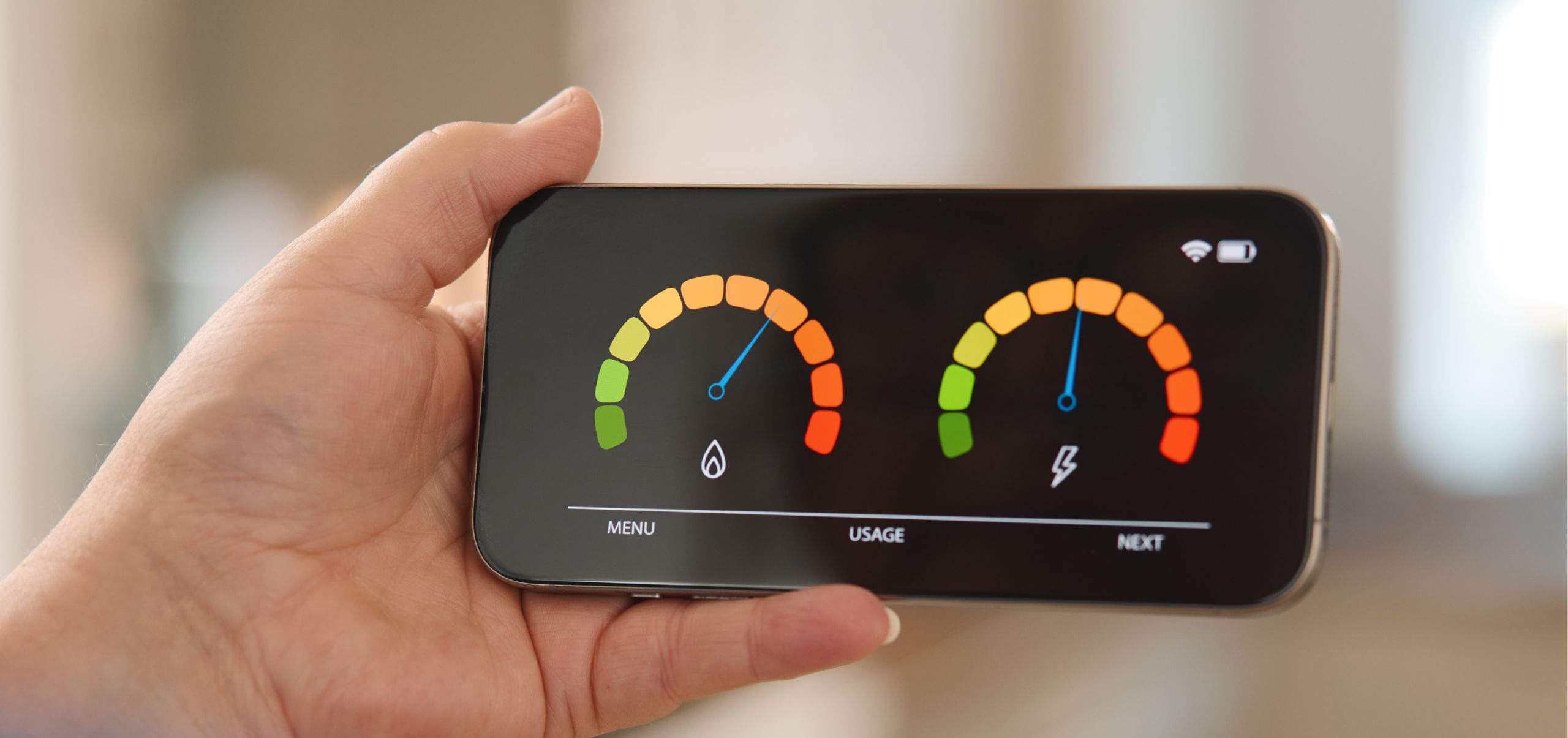 Person holding a phone displaying performance results, representing monitoring sustainable initiatives