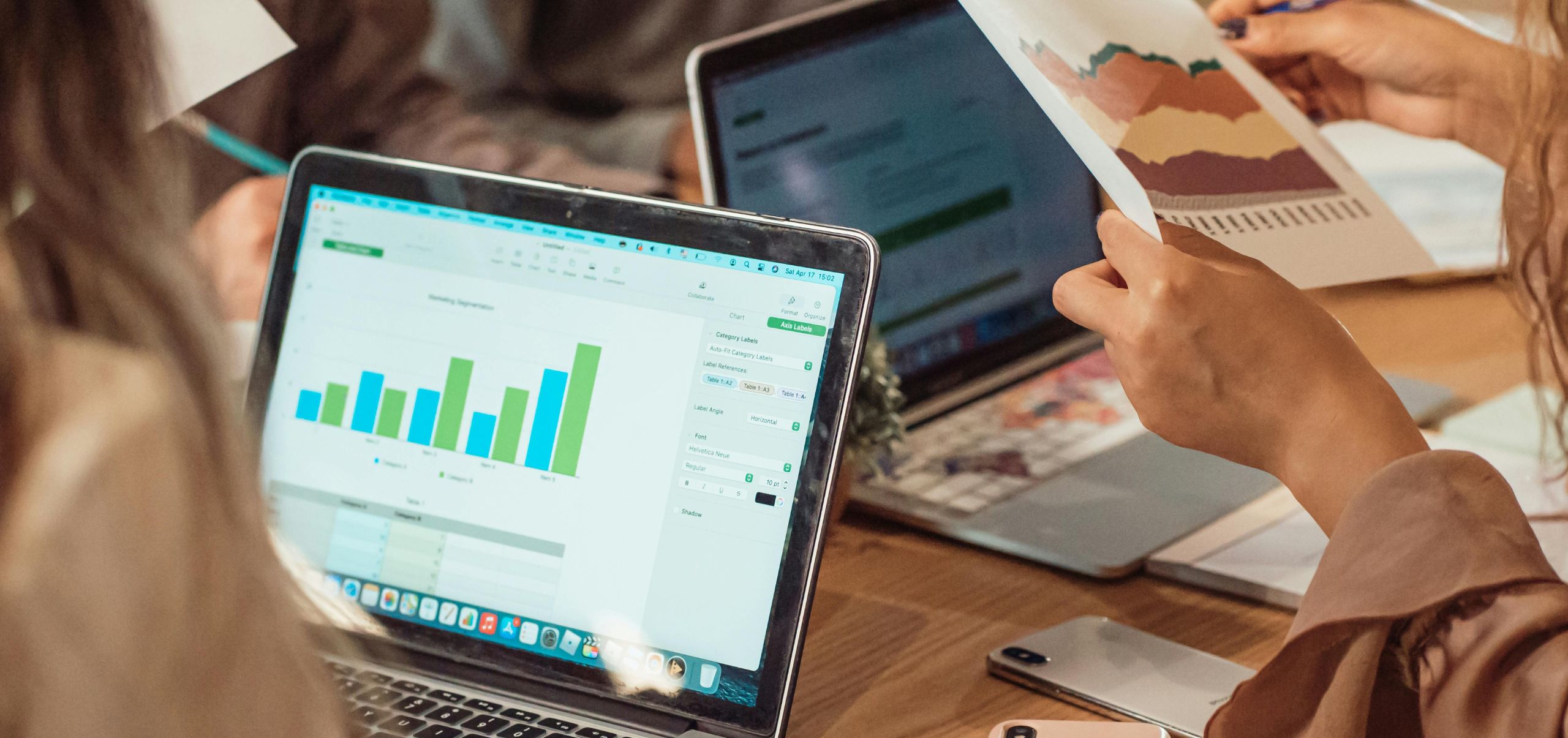 A woman analyzing a bar chart on a laptop to see if her business idea has potential