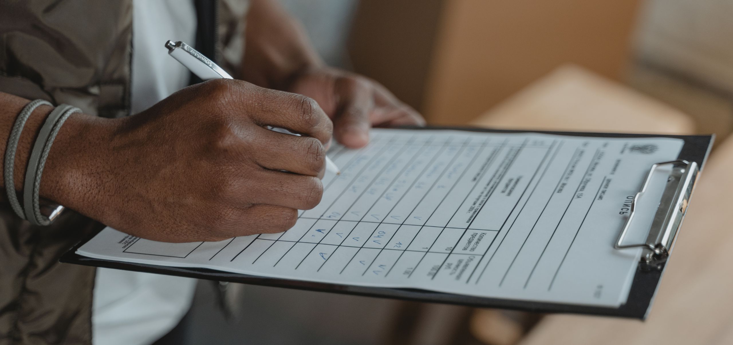 Person collecting data on a clipboard