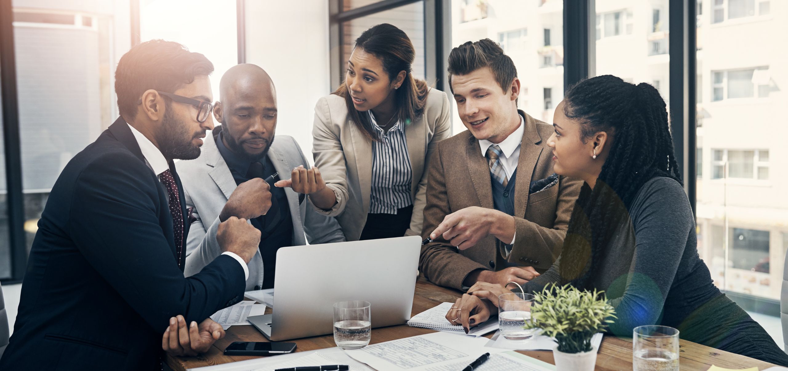 A team actively communicating to demonstrate collaboration and strong workplace communication skills